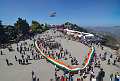 Shimla: Locals carry a huge Tricolour during a 3km long Tiranga Yatra, in Shimla, Tuesday, March 29, 2022. (PTI Photo)  (PTI03_29_2022_000121A)